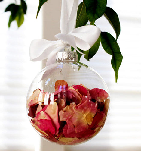 Four clear glass baubles, each 6cm in diameter, with silver caps, ideal for festive decorations and crafts.