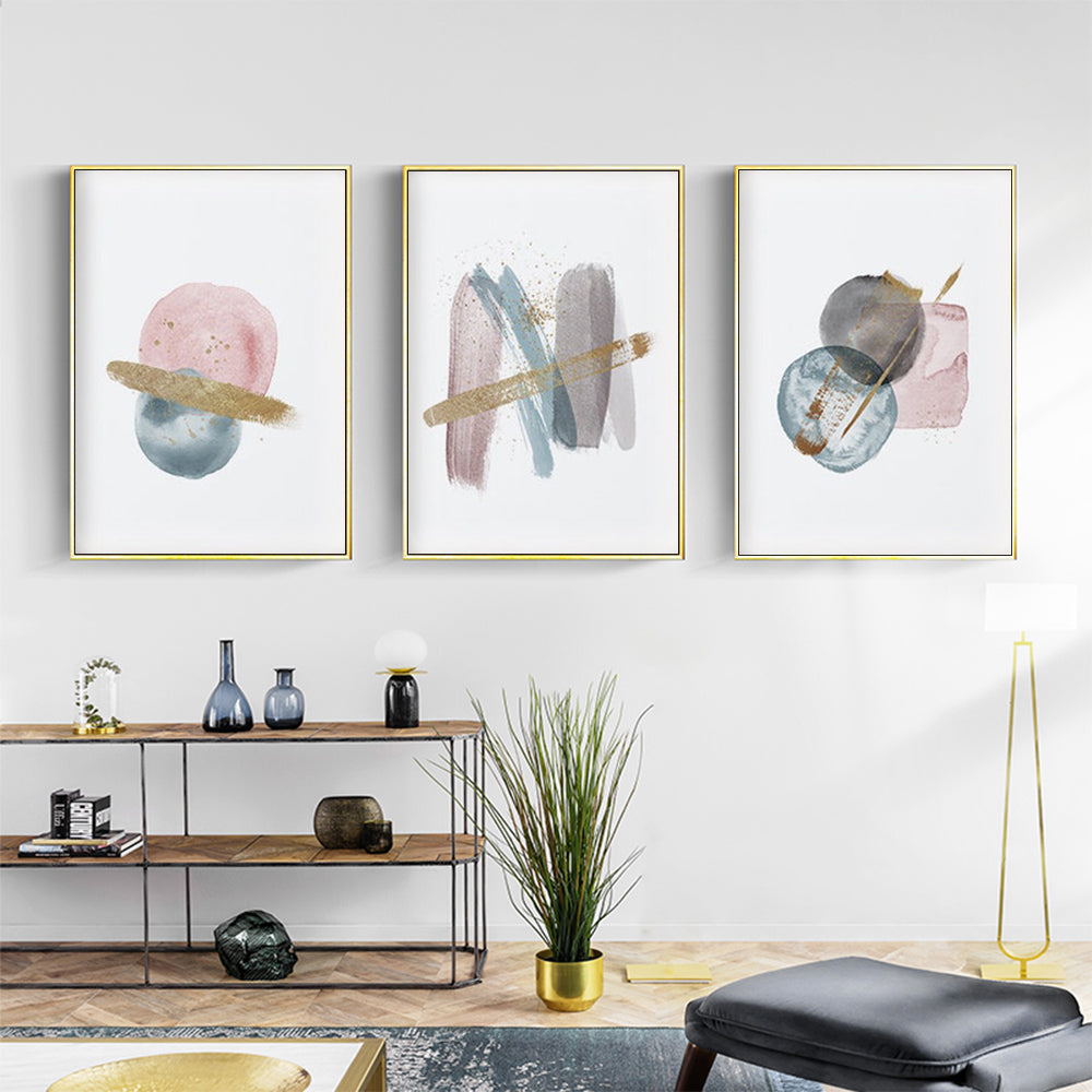 Blush pink watercolor canvas wall art in gold frame, showcasing elegant design and premium quality.