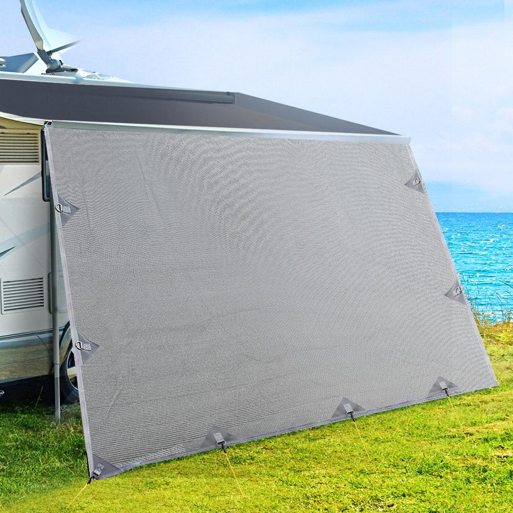 4.0M Caravan Privacy Screen attached to a roll-out awning, showcasing its grey water-repellent fabric and stainless steel D-rings.