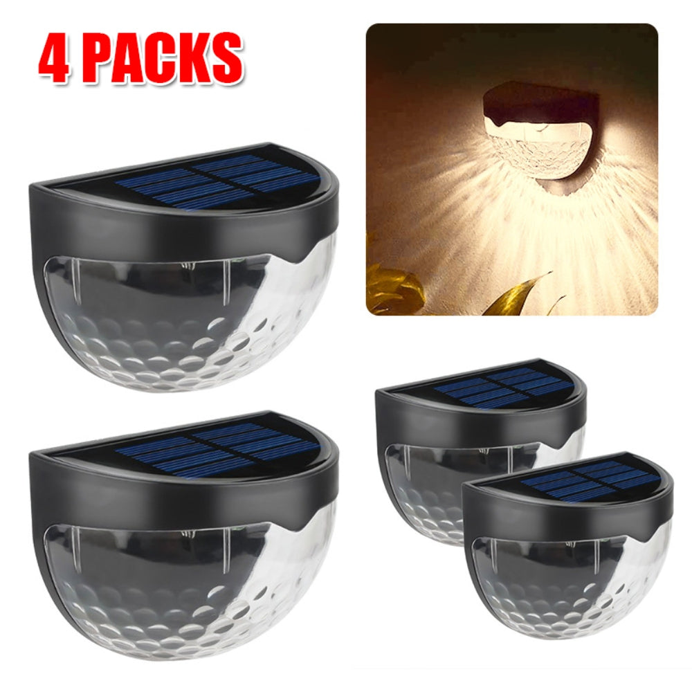 Four solar powered LED wall lights made of stainless steel, designed for outdoor use, illuminating pathways and gardens.