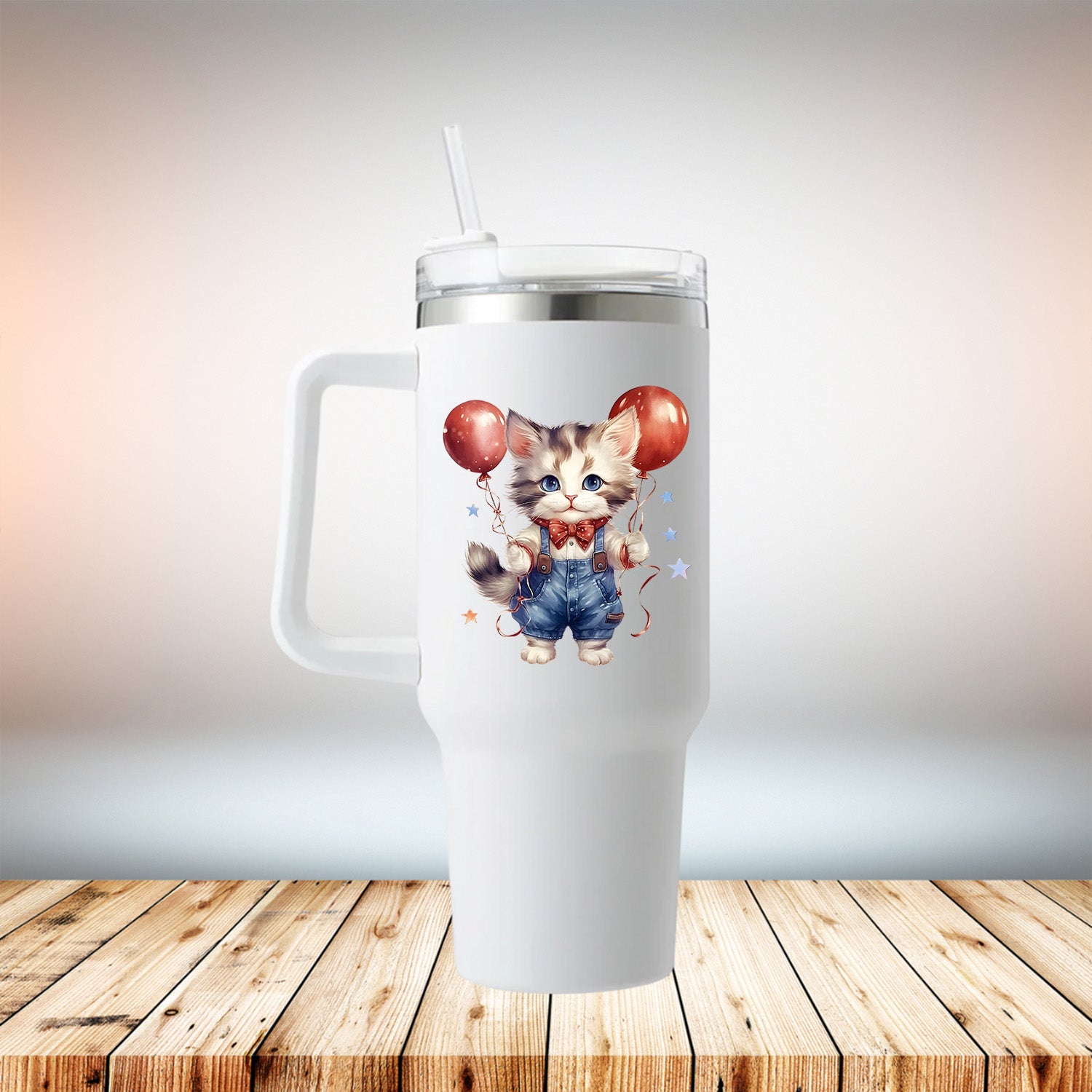 A stylish 40oz travel mug featuring a cute kitten design, made of stainless steel with a removable plastic handle, perfect for summer drinks.