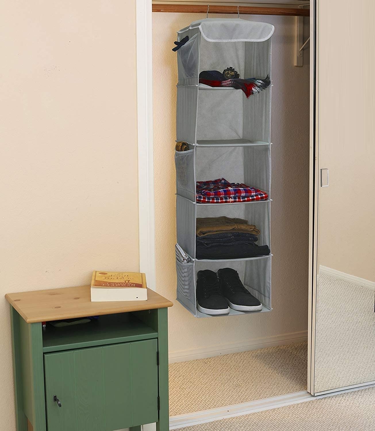 5 Foldable Shelf Hanging Closet Organizer with side pockets, showcasing its durable design and spacious shelves for efficient storage.