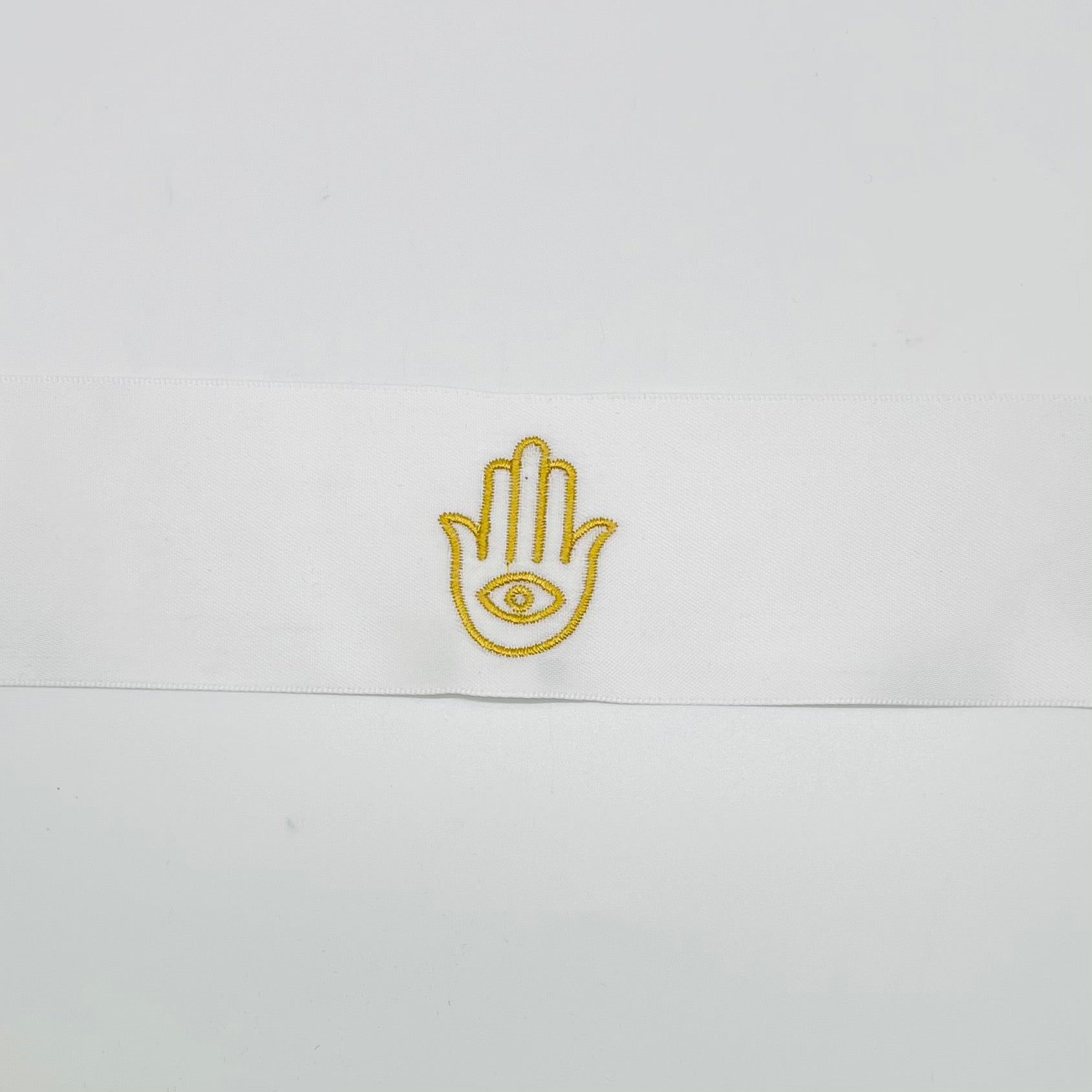 A pack of 50 embroidered Hamsa satin ribbons, each measuring 2 x 20 inches, perfect for henna parties and decorations.