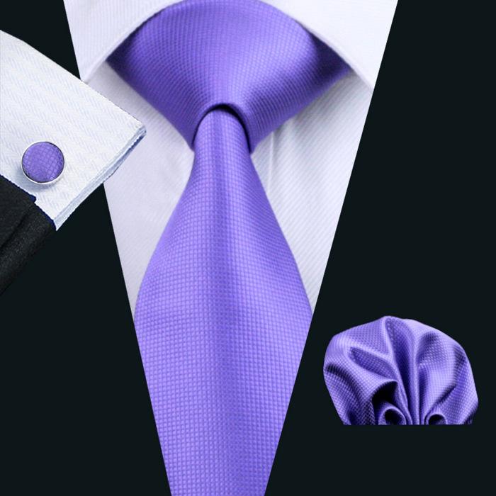 A stylish set of 50 solid color silk men's ties with matching handkerchief and cufflinks, showcasing various colors and elegant design.