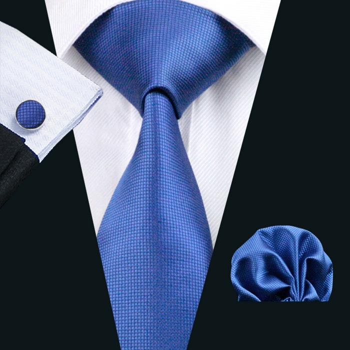 A stylish set of 50 solid color silk men's ties with matching handkerchief and cufflinks, showcasing various colors and elegant design.