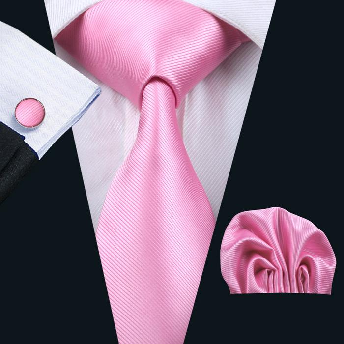 A stylish set of 50 solid color silk men's ties with matching handkerchief and cufflinks, showcasing various colors and elegant design.