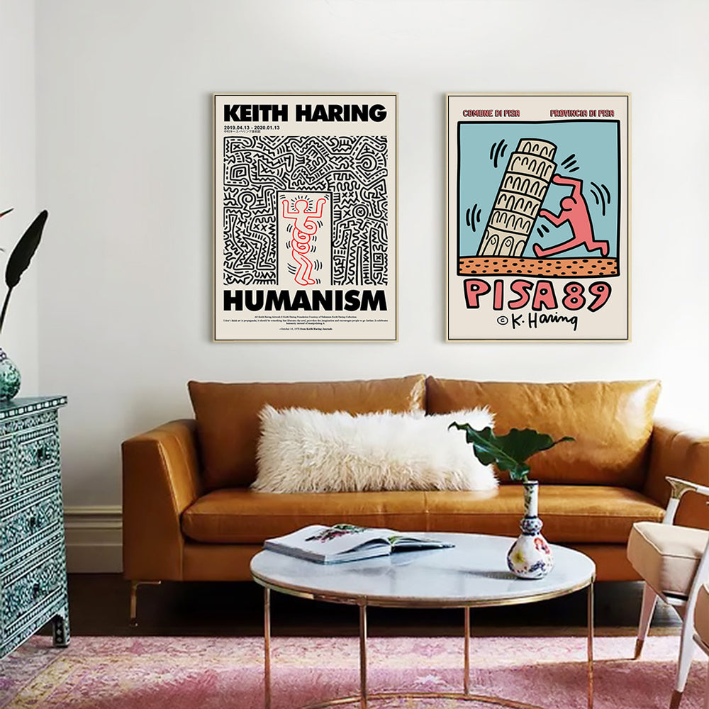 50cmx50cm wall art by Keith Haring in a gold frame, showcasing vibrant colors and a unique floating effect.