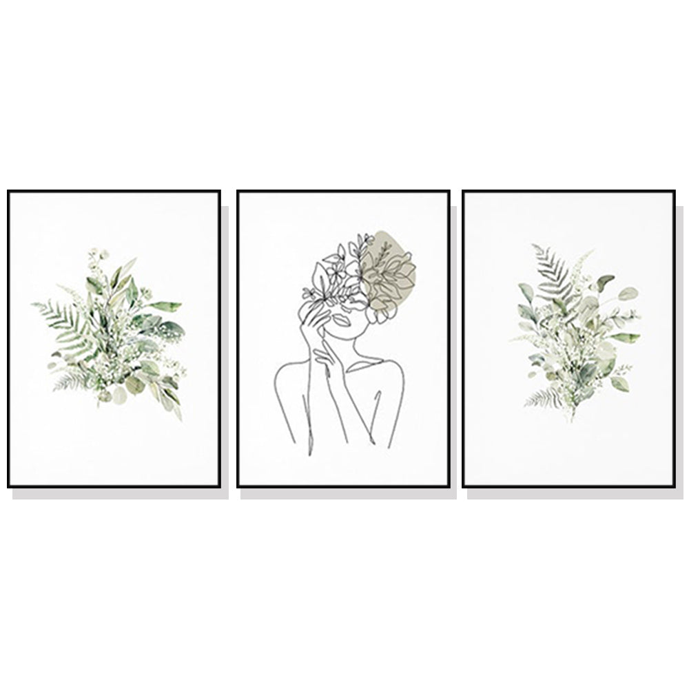 Three sets of Botanical Line Girl canvas wall art in black frames, showcasing elegant botanical designs.