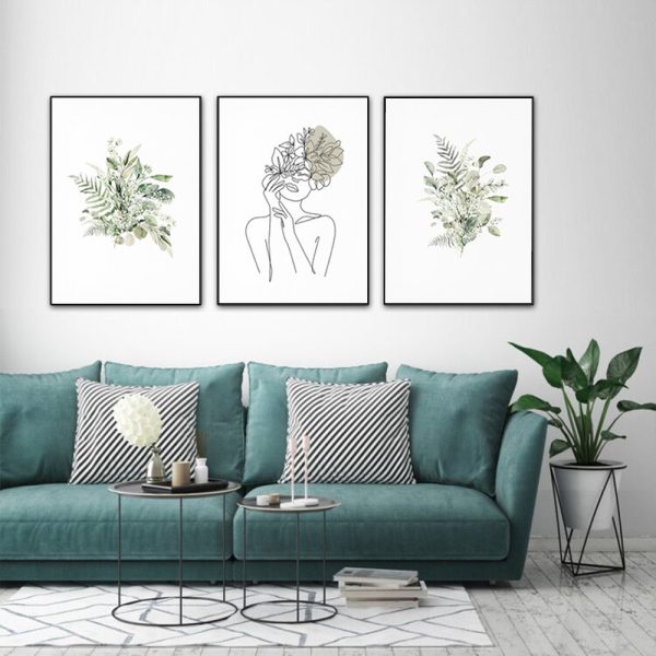 Three sets of Botanical Line Girl canvas wall art in black frames, showcasing elegant botanical designs.