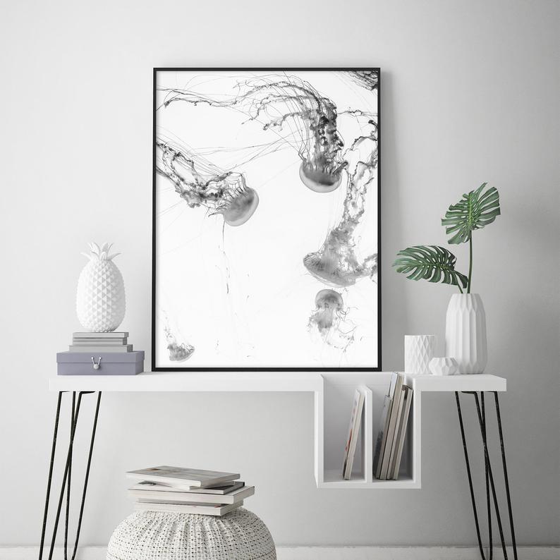 50cmx70cm Jellyfish Canvas Wall Art in a black frame, showcasing vibrant colors and a floating effect.