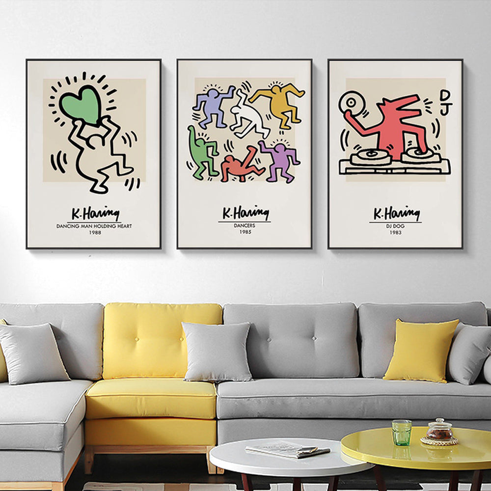 Three sets of Keith Haring Pop Art canvas prints framed in black, showcasing vibrant colors and bold designs, ready to hang on a wall.