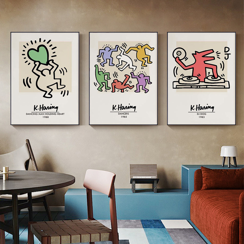 Three sets of Keith Haring Pop Art canvas prints framed in black, showcasing vibrant colors and bold designs, ready to hang on a wall.