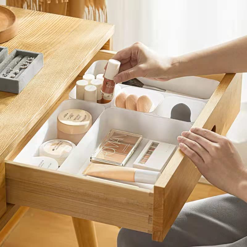 A set of six frosted plastic drawer organizers in various sizes, ideal for makeup, kitchenware, and office supplies, displayed on a clean surface.