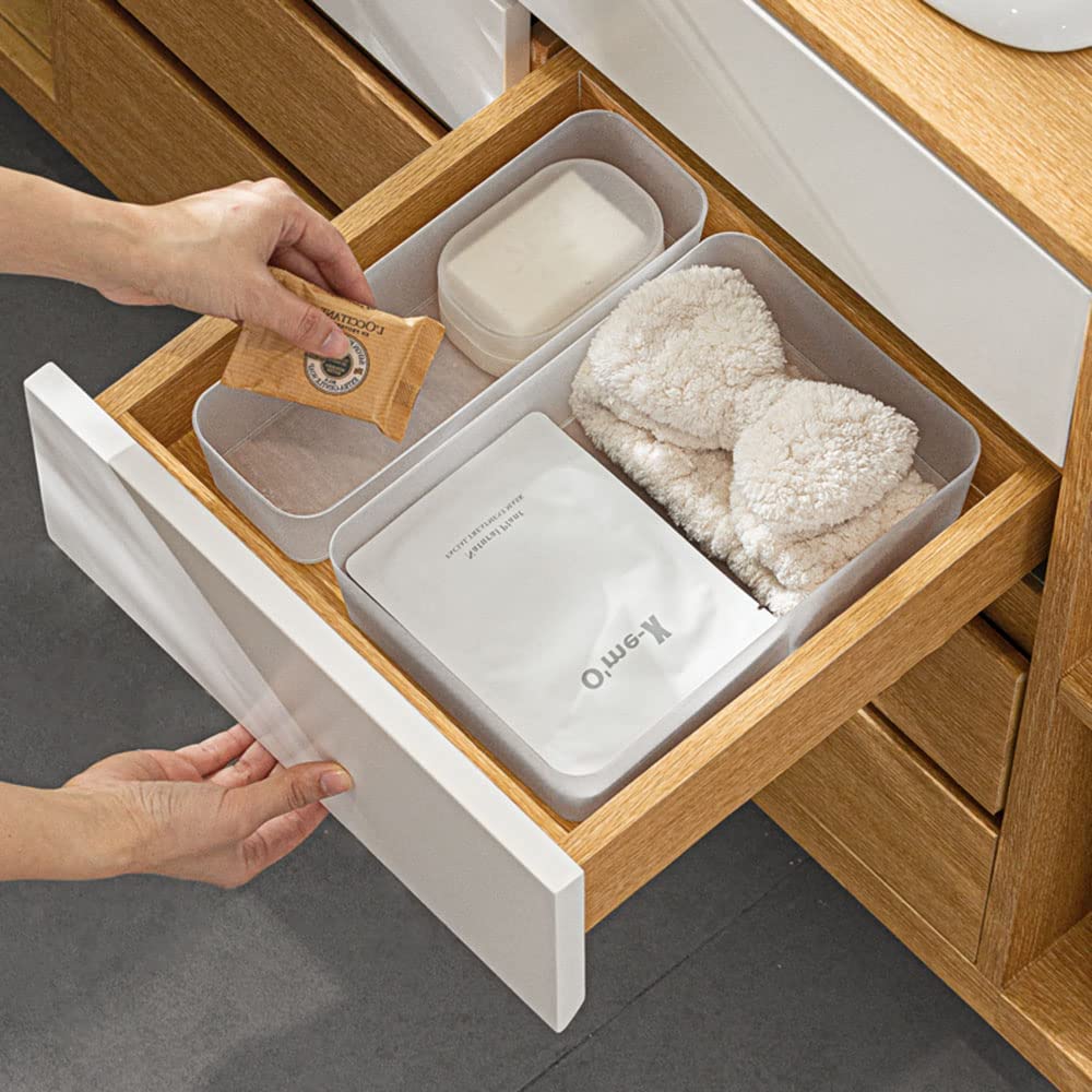 A set of six frosted plastic drawer organizers in various sizes, ideal for makeup, kitchenware, and office supplies, displayed on a clean surface.