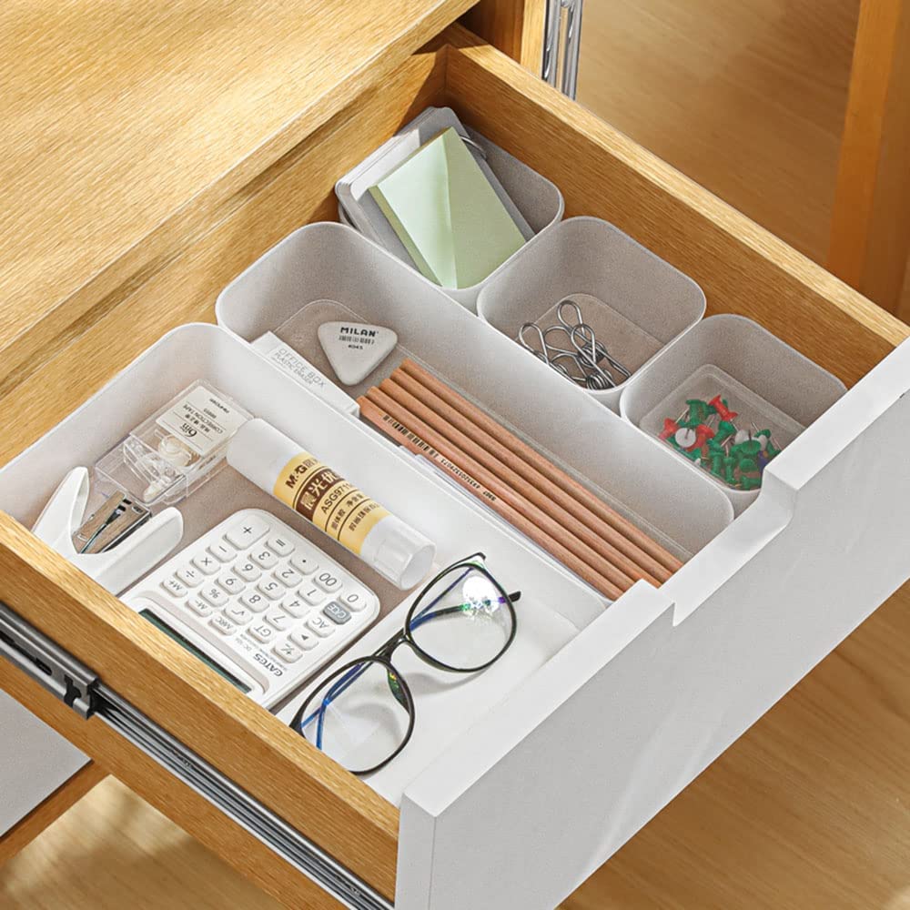 A set of six frosted plastic drawer organizers in various sizes, ideal for makeup, kitchenware, and office supplies, displayed on a clean surface.