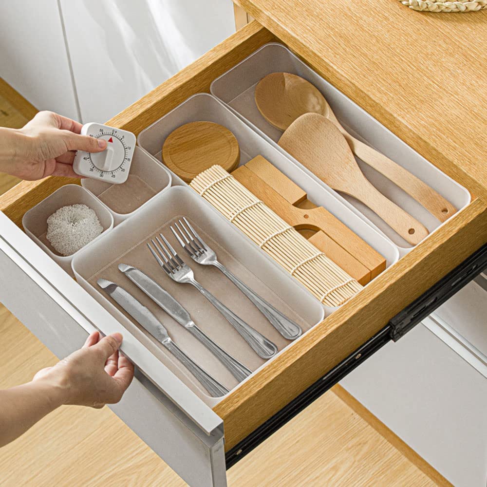 A set of six frosted plastic drawer organizers in various sizes, ideal for makeup, kitchenware, and office supplies, displayed on a clean surface.