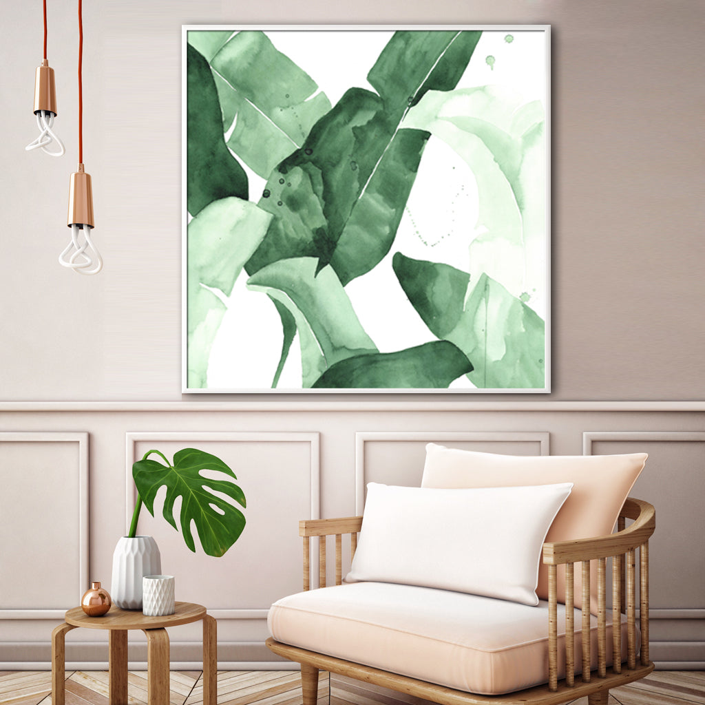 60cmx60cm Tropical Leaves Canvas Wall Art in a white frame, showcasing vibrant green leaves on a premium canvas.