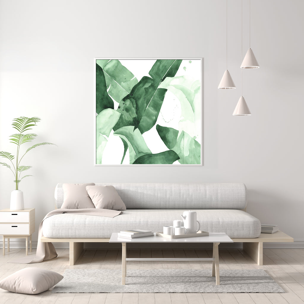 60cmx60cm Tropical Leaves Canvas Wall Art in a white frame, showcasing vibrant green leaves on a premium canvas.