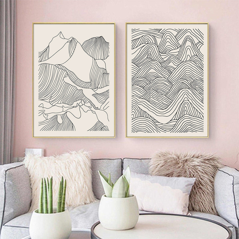 Two sets of 60cmx90cm line art mountain canvas wall art framed in elegant gold, showcasing a modern design.