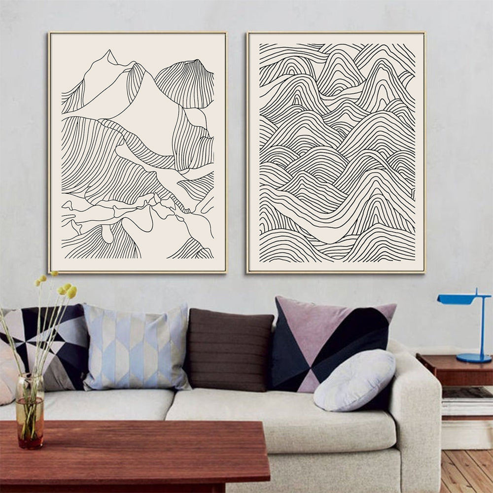 Two sets of 60cmx90cm line art mountain canvas wall art framed in elegant gold, showcasing a modern design.