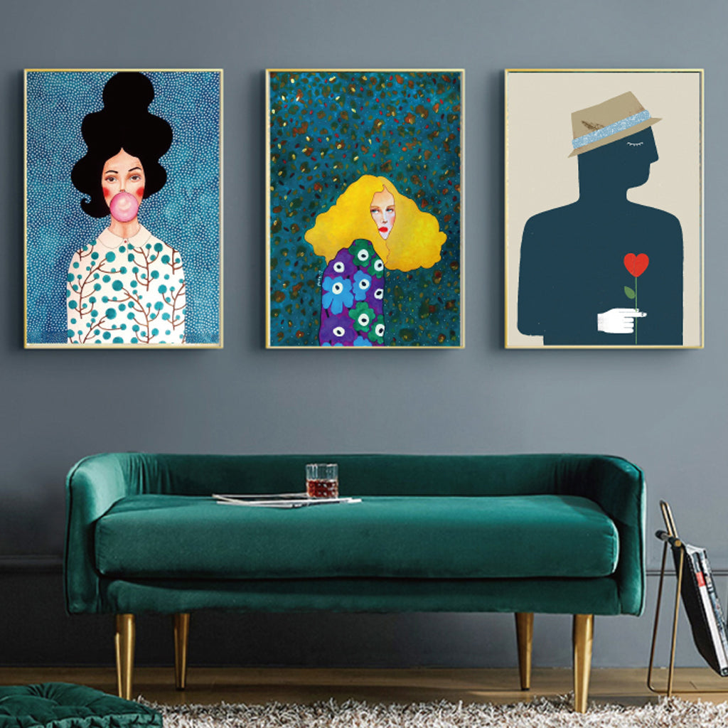 Three modern figure canvas wall art pieces in gold frames, showcasing vibrant colors and a floating effect, perfect for home decor.