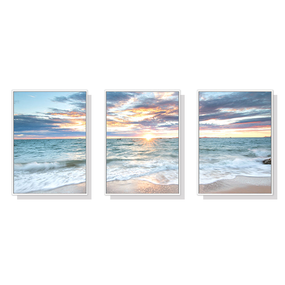 60cmx90cm canvas wall art featuring a serene sunrise over the ocean, framed in a stylish white floating frame.