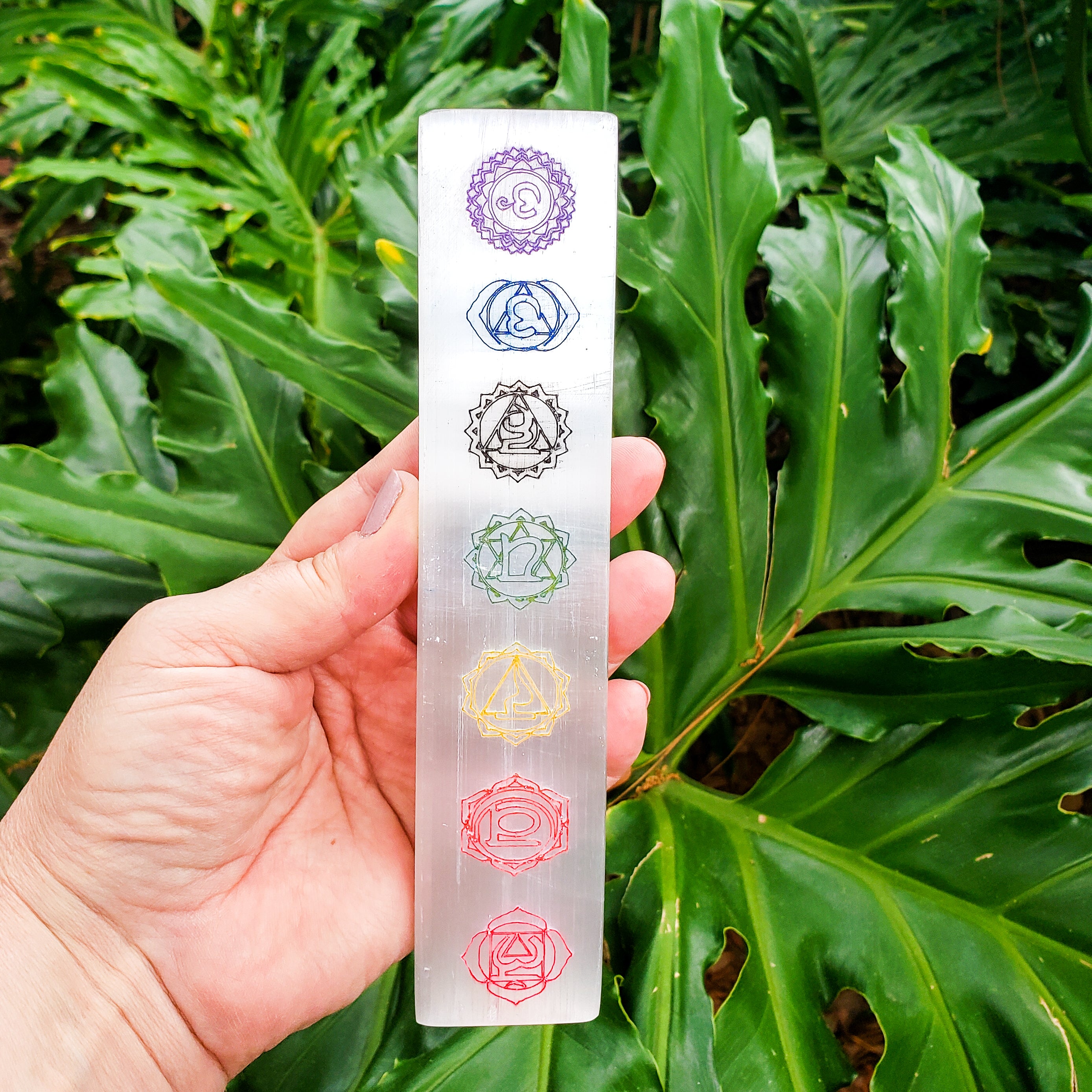 7 Chakras Color Laser Engraved Selenite Bar with vibrant chakra symbols for crystal cleansing and chakra balancing.