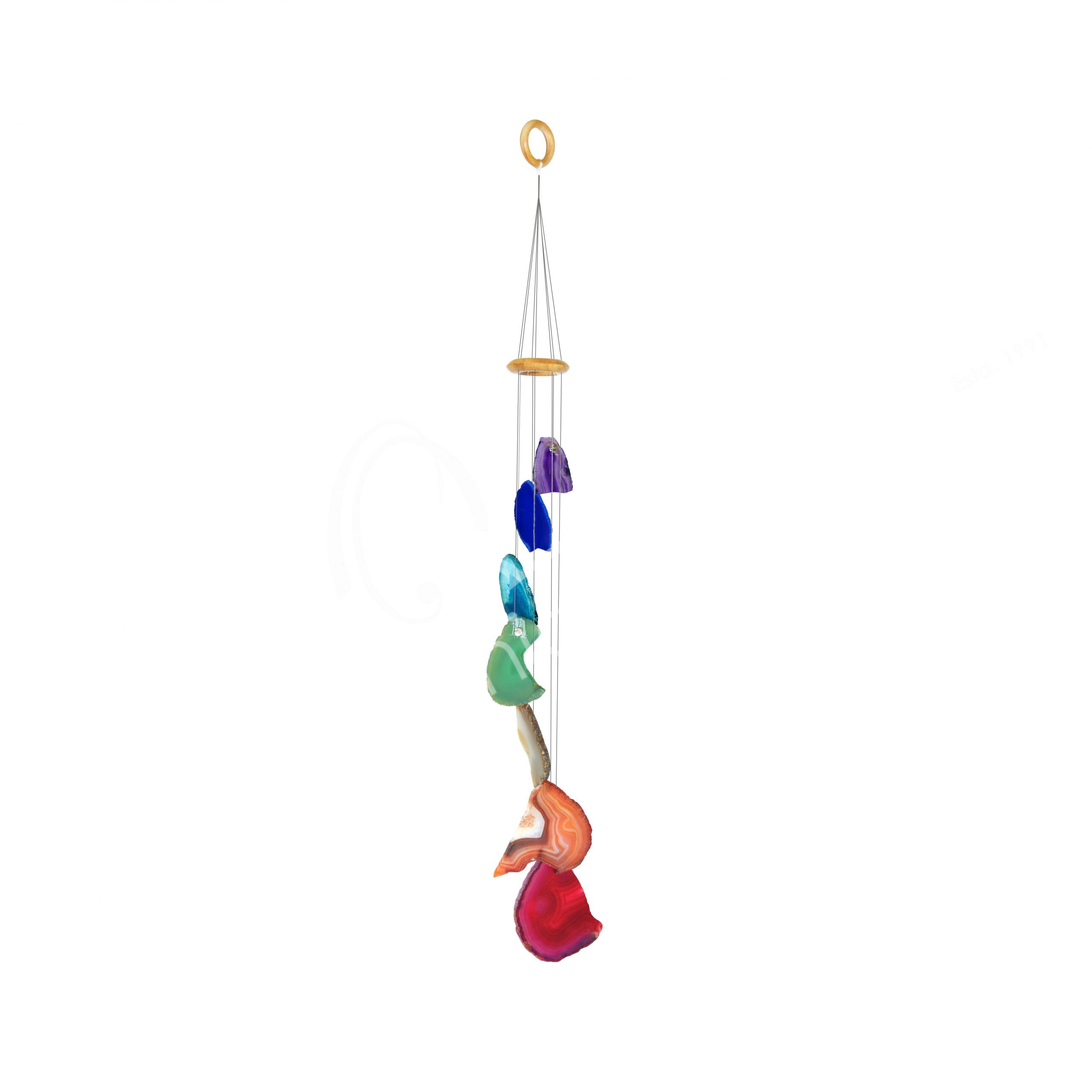 A beautiful 7 Chakras Natural Agate Slice Wind Chime featuring seven colorful agate slices, hanging gracefully in a serene outdoor setting.