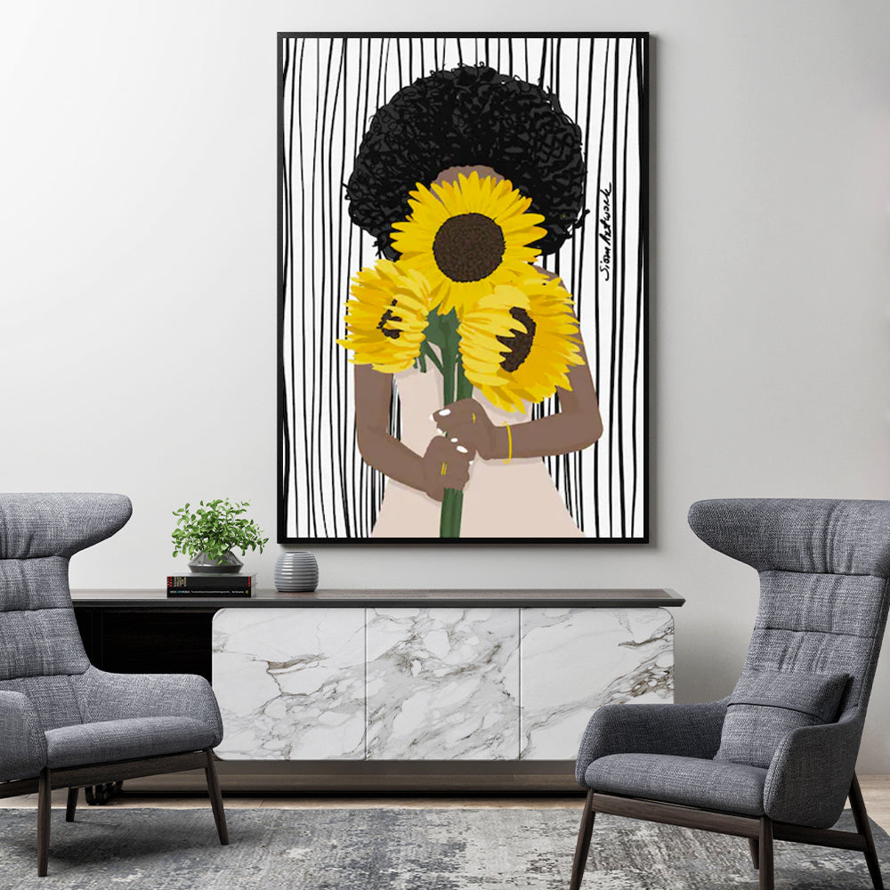 80cmx120cm canvas wall art featuring an African woman surrounded by sunflowers, framed in a sleek black frame.