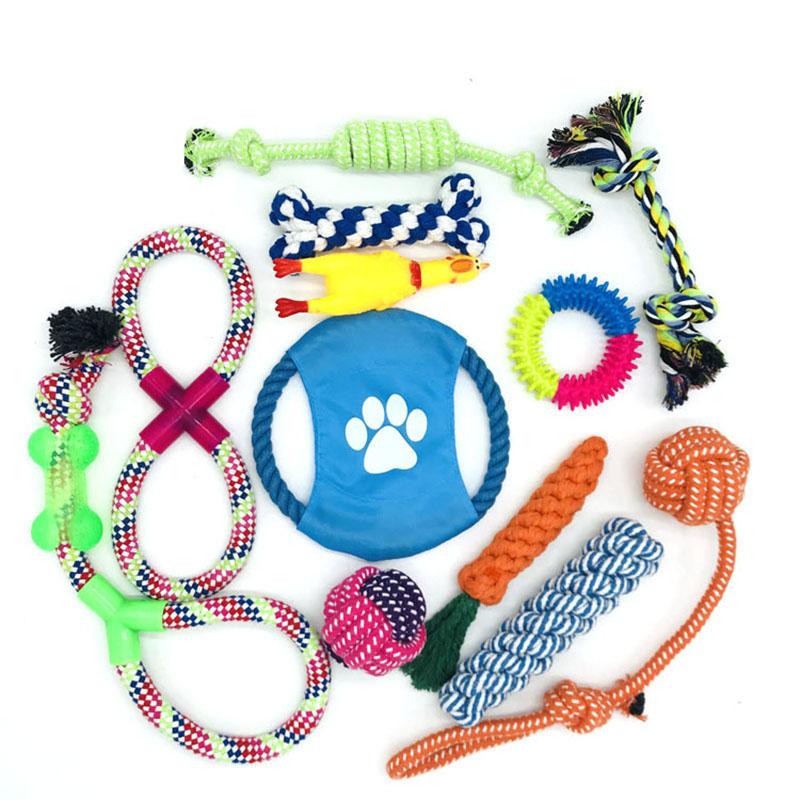 A colorful set of handwoven cotton rope dog chew toys, including various shapes and sizes, designed for interactive play and dental health.