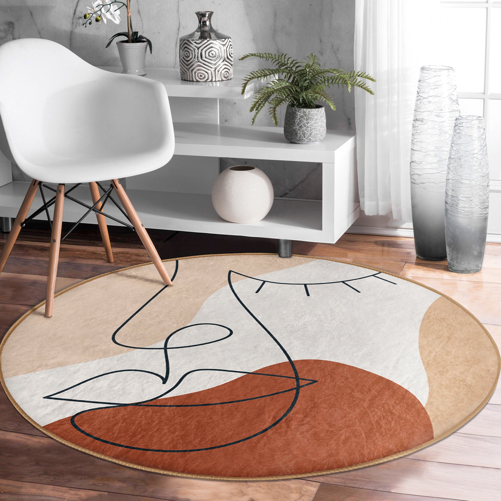 Abstract Face Patterned Round Rug in vibrant colors, showcasing a unique design and soft velvet texture, perfect for modern interiors.