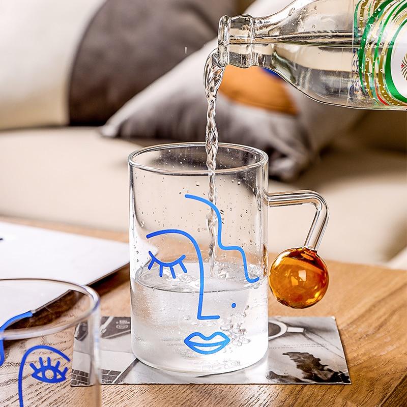 A stylish Abstract Glass Mug with unique artistic patterns, perfect for enjoying beverages.