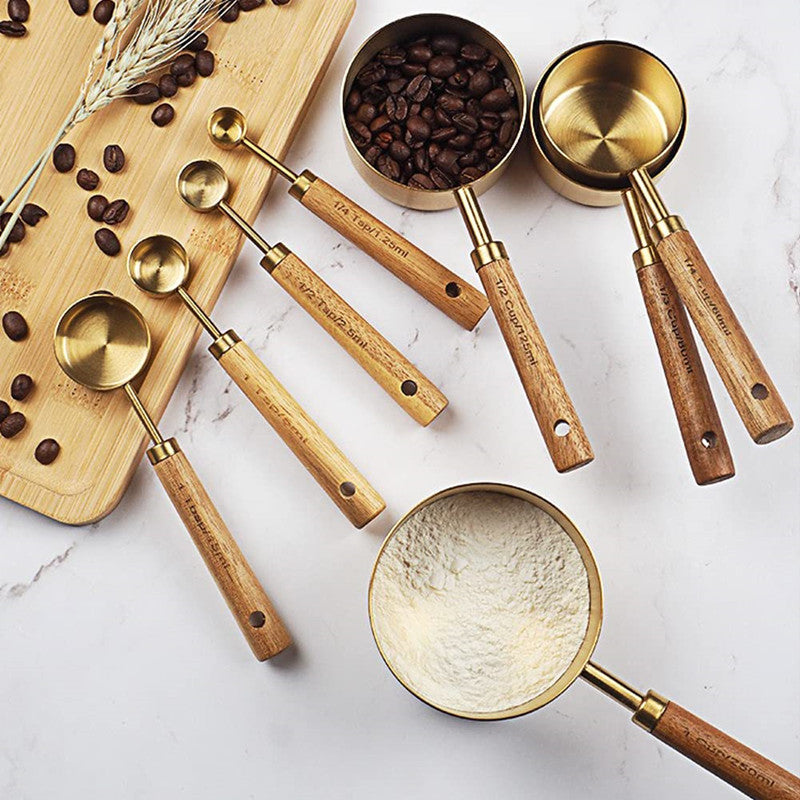 Acacia Wooden Handle Stainless Steel Measuring Cup and Spoon set showcasing elegant design and durable materials.