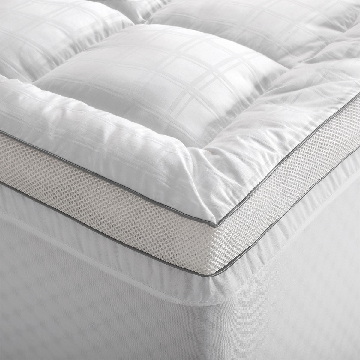 Accessorize Deluxe Hotel Mattress Topper King in solid white, showcasing soft cotton fabric and plush polyester filling.