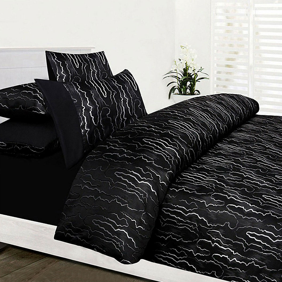 Accessorize Naples Black Jacquard Quilt Cover Set featuring a luxurious black and silver jacquard texture, perfect for contemporary bedroom decor.