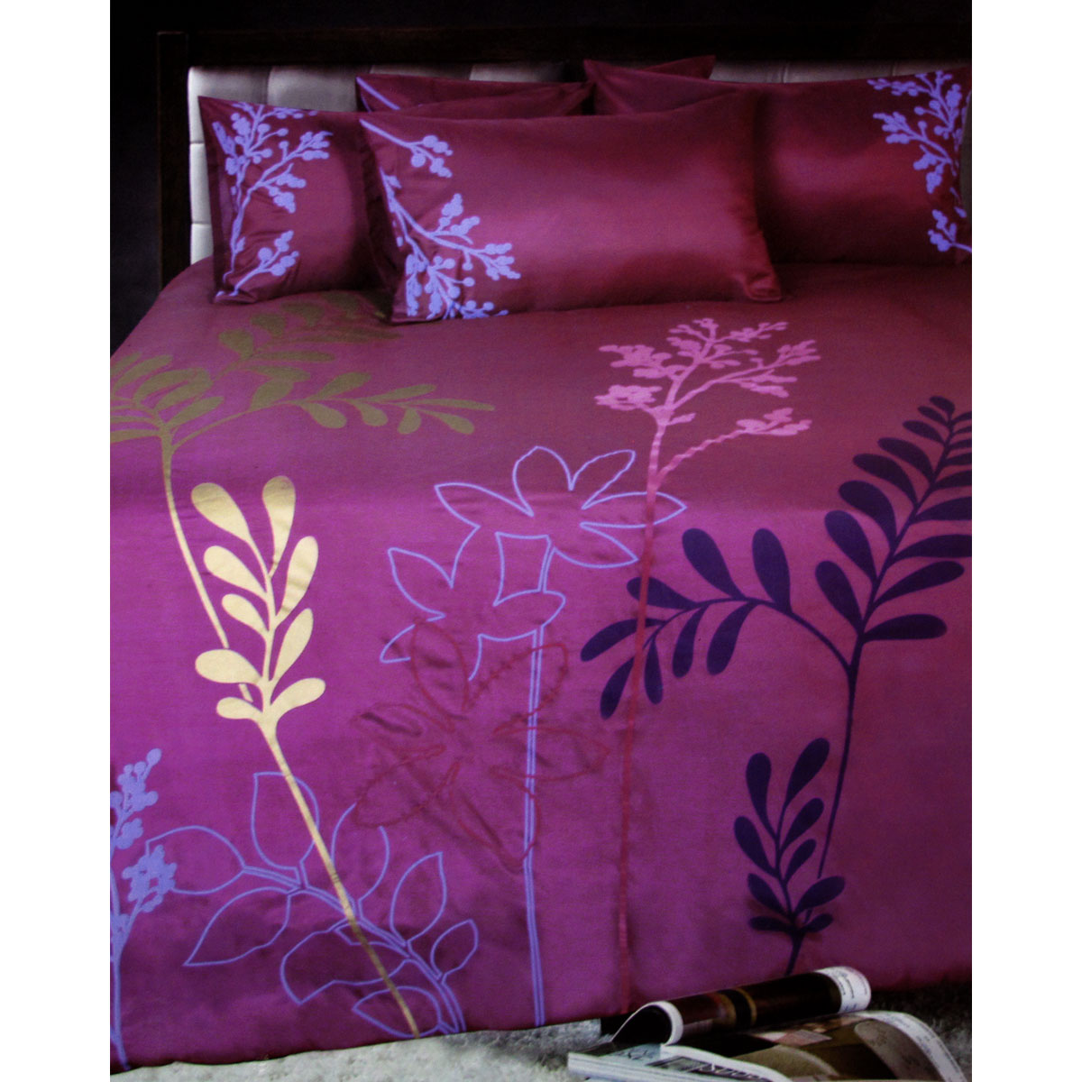 Accessorize Savannah Plum Quilt Cover Set featuring foliage design in plum, pink, gold, lilac, and aubergine colors, perfect for a luxurious bedroom.