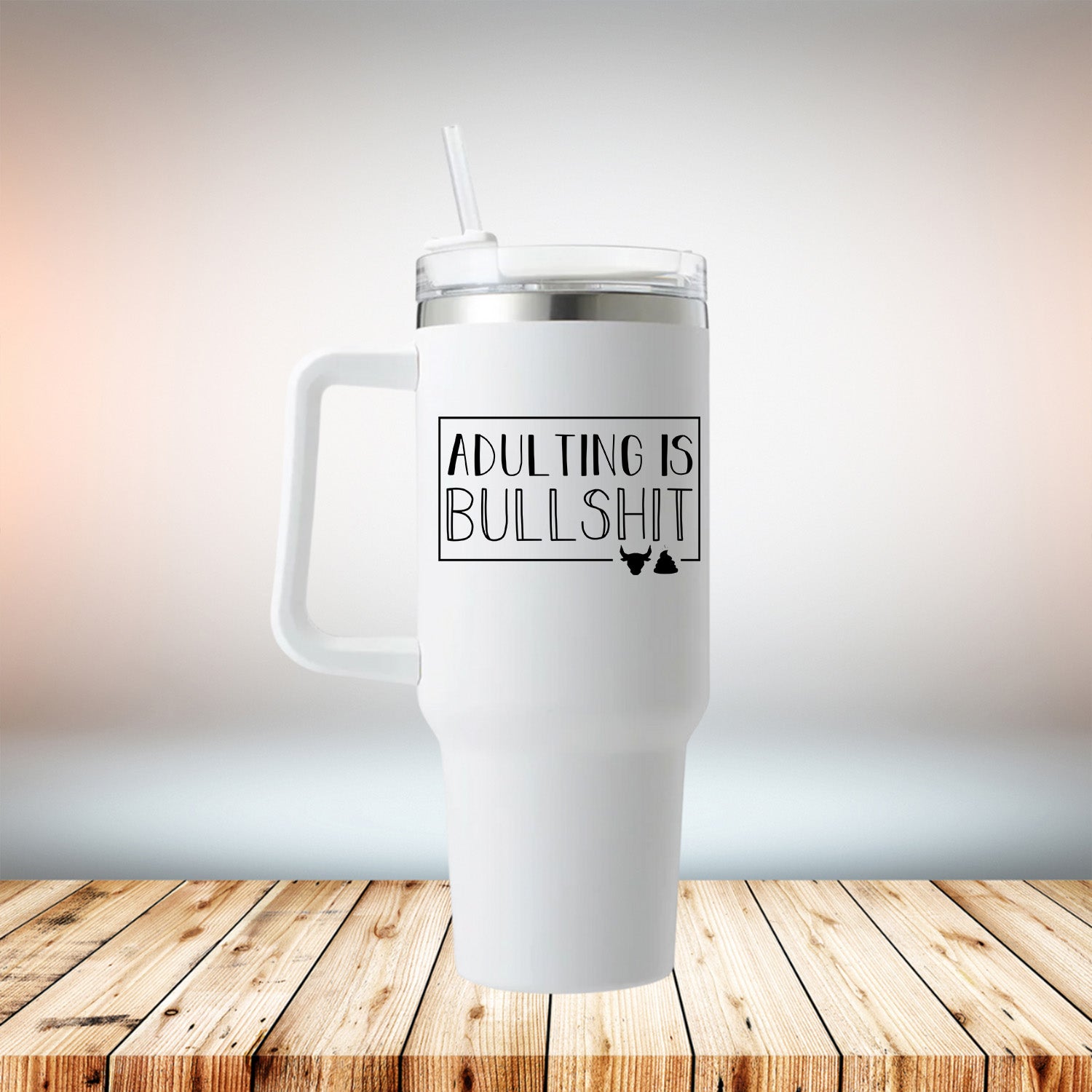 Adulting is Bullshit 40oz Travel Mug in white stainless steel with removable handle and straw-friendly lid.