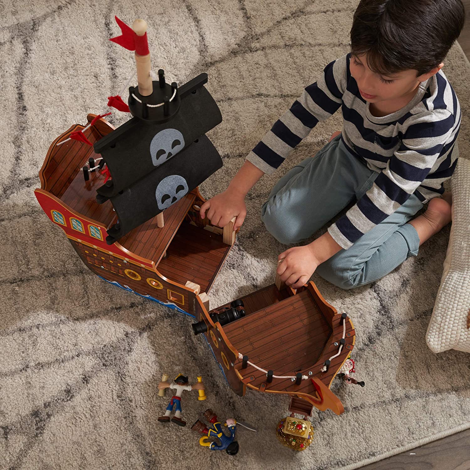 Adventure Bound Pirate Ship for kids, featuring a wooden design with interactive elements like a cannon that lights up and makes sounds.