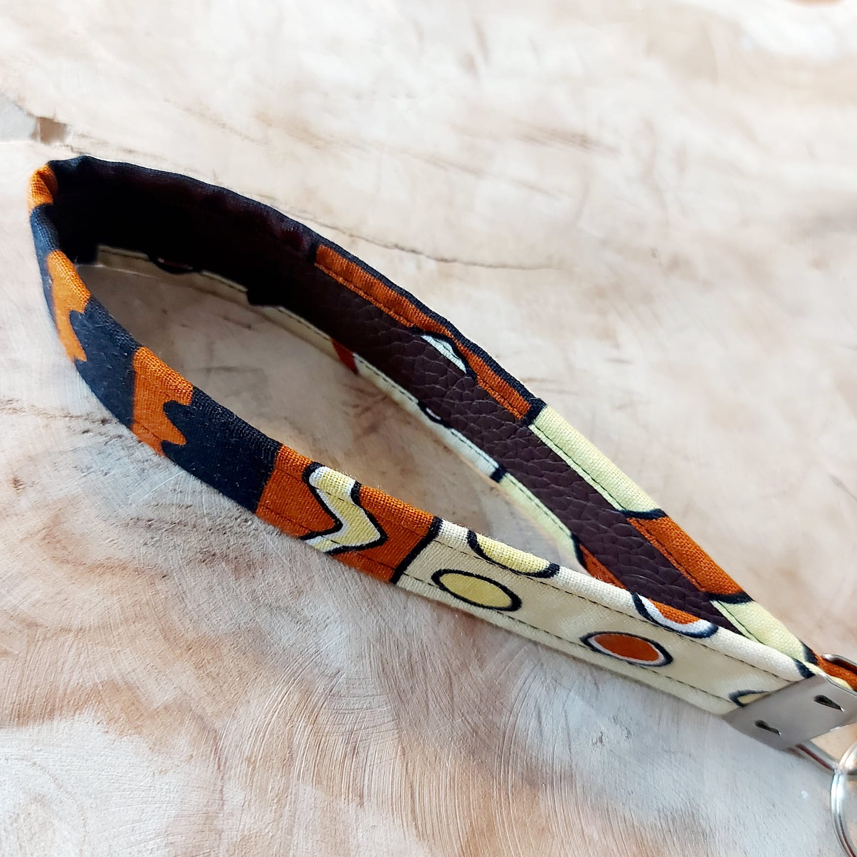 African Print and Leather Key Fob wristlet, featuring vibrant fabric and sturdy vegan leather lining, perfect for key organization.