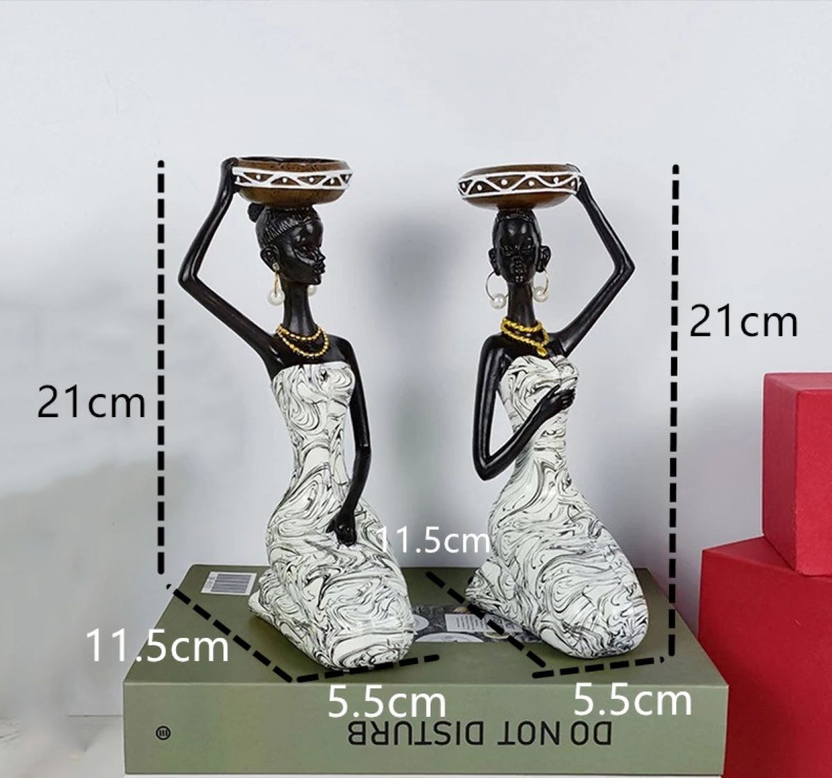 An elegant African sculpture candleholder made of polyresin, showcasing intricate details and cultural artistry, perfect for home decor.