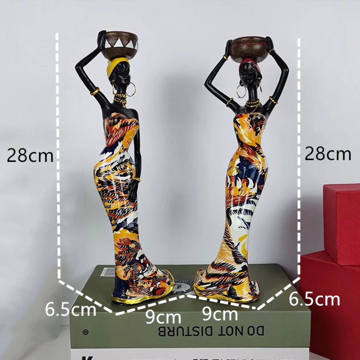 An elegant African sculpture candleholder made of polyresin, showcasing intricate details and cultural artistry, perfect for home decor.