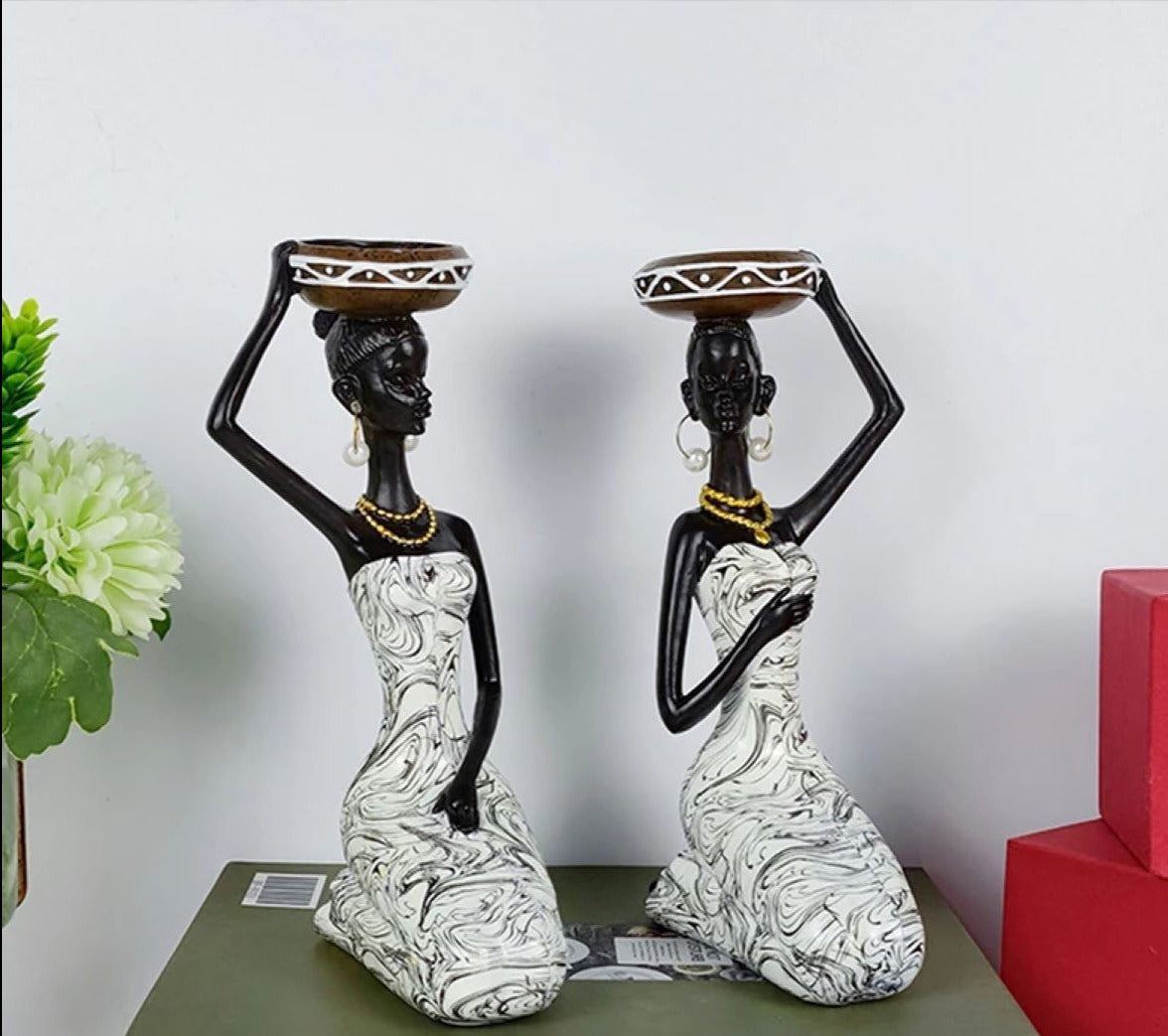 An elegant African sculpture candleholder made of polyresin, showcasing intricate details and cultural artistry, perfect for home decor.