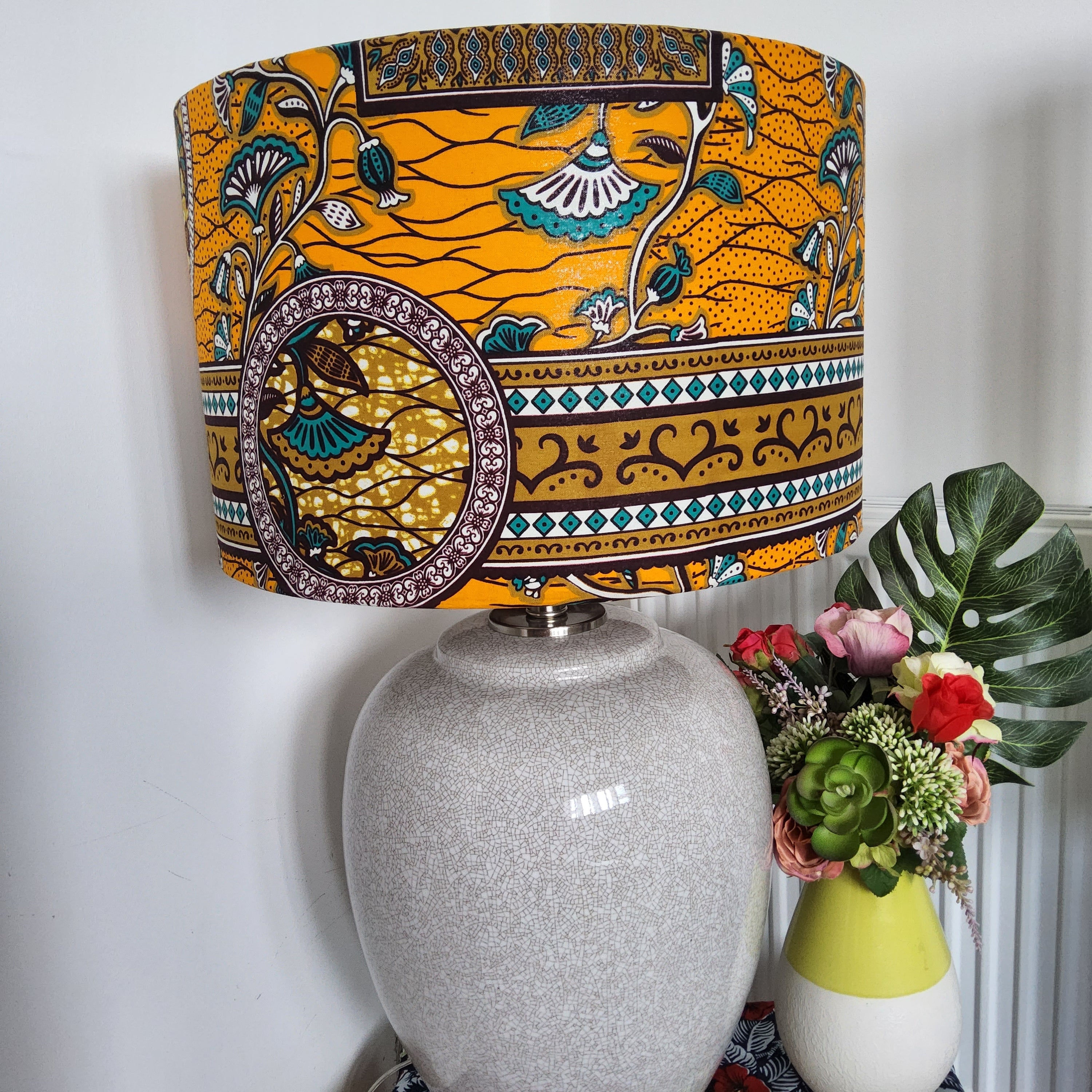 AfroBrit Fusion 50x50cm square cushion featuring vibrant Ankara fabric and luxurious velvet finish, perfect for home decor.