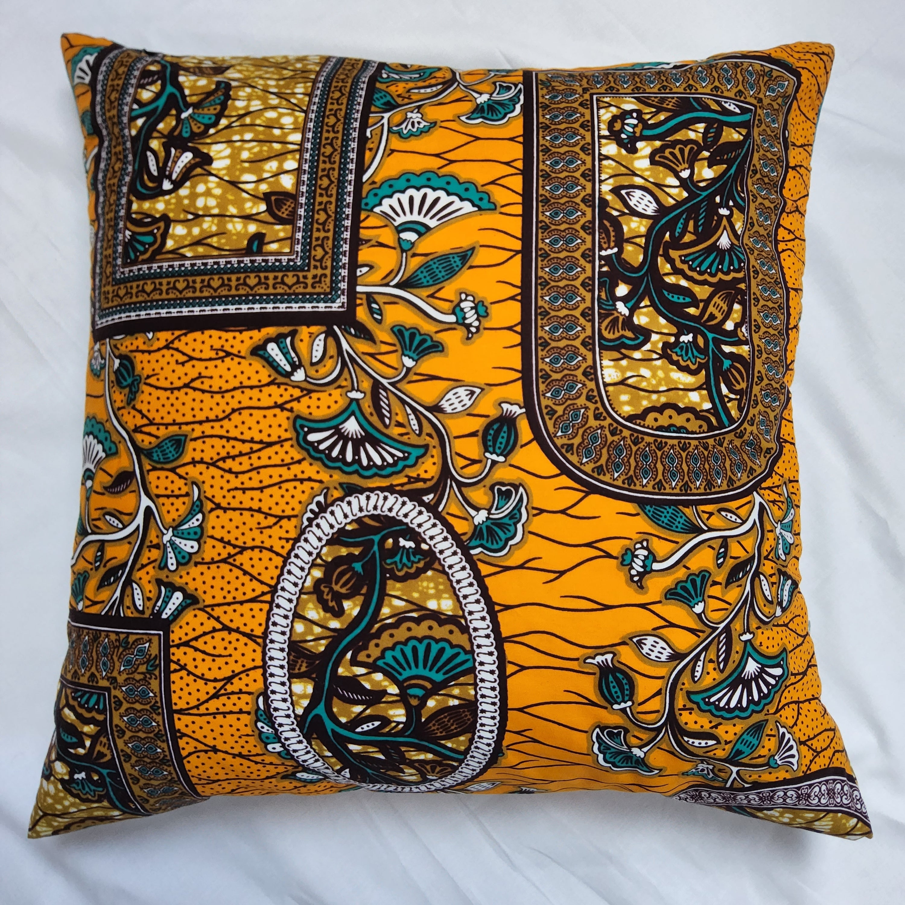 AfroBrit Fusion 50x50cm square cushion featuring vibrant Ankara fabric and luxurious velvet finish, perfect for home decor.