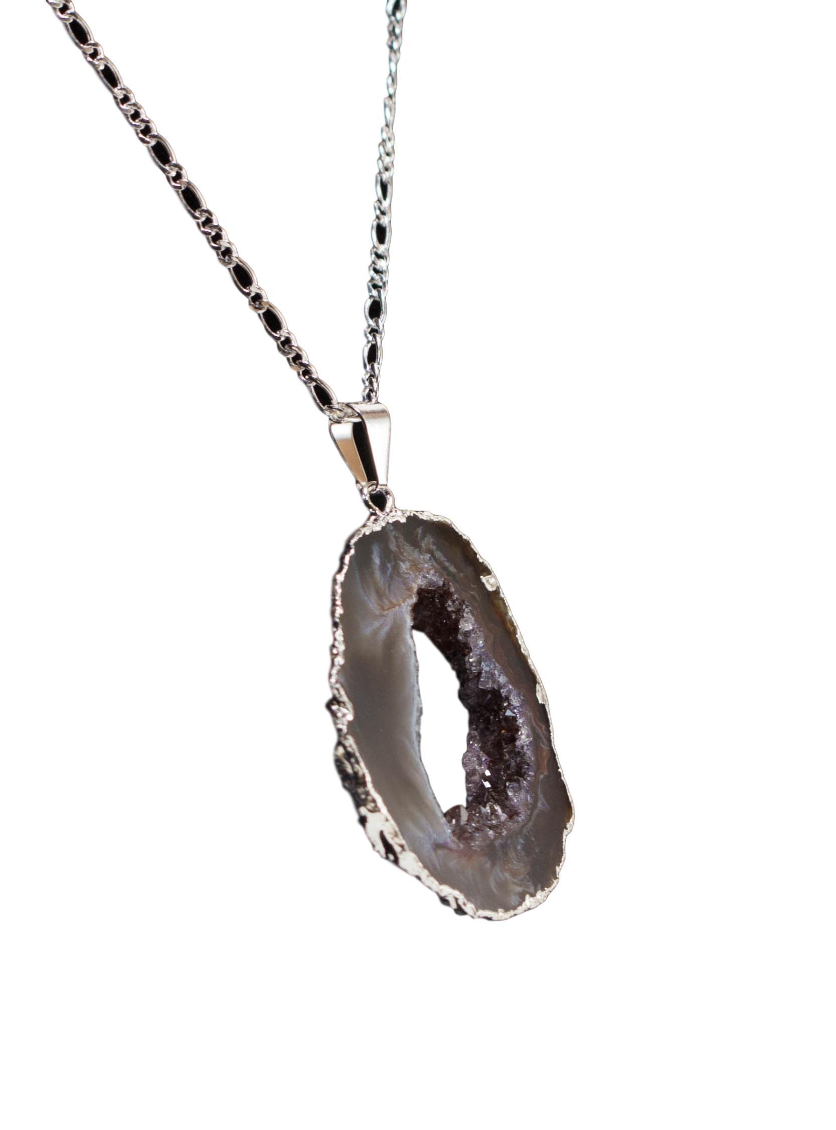 Agate Geode Chain Necklace featuring a sparkling agate geode pendant with gold or silver trim on a delicate chain.