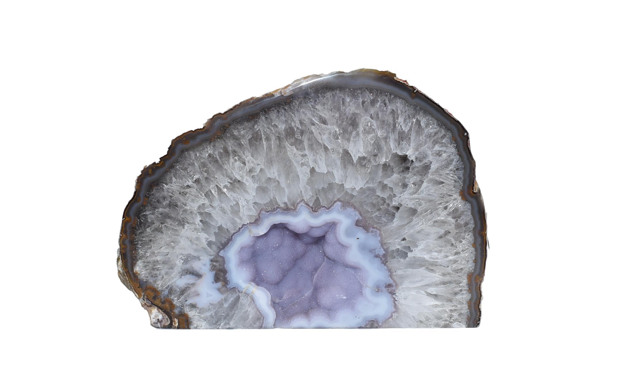 A beautiful agate geode with natural trim showcasing vibrant colors and intricate patterns, perfect for home decoration.