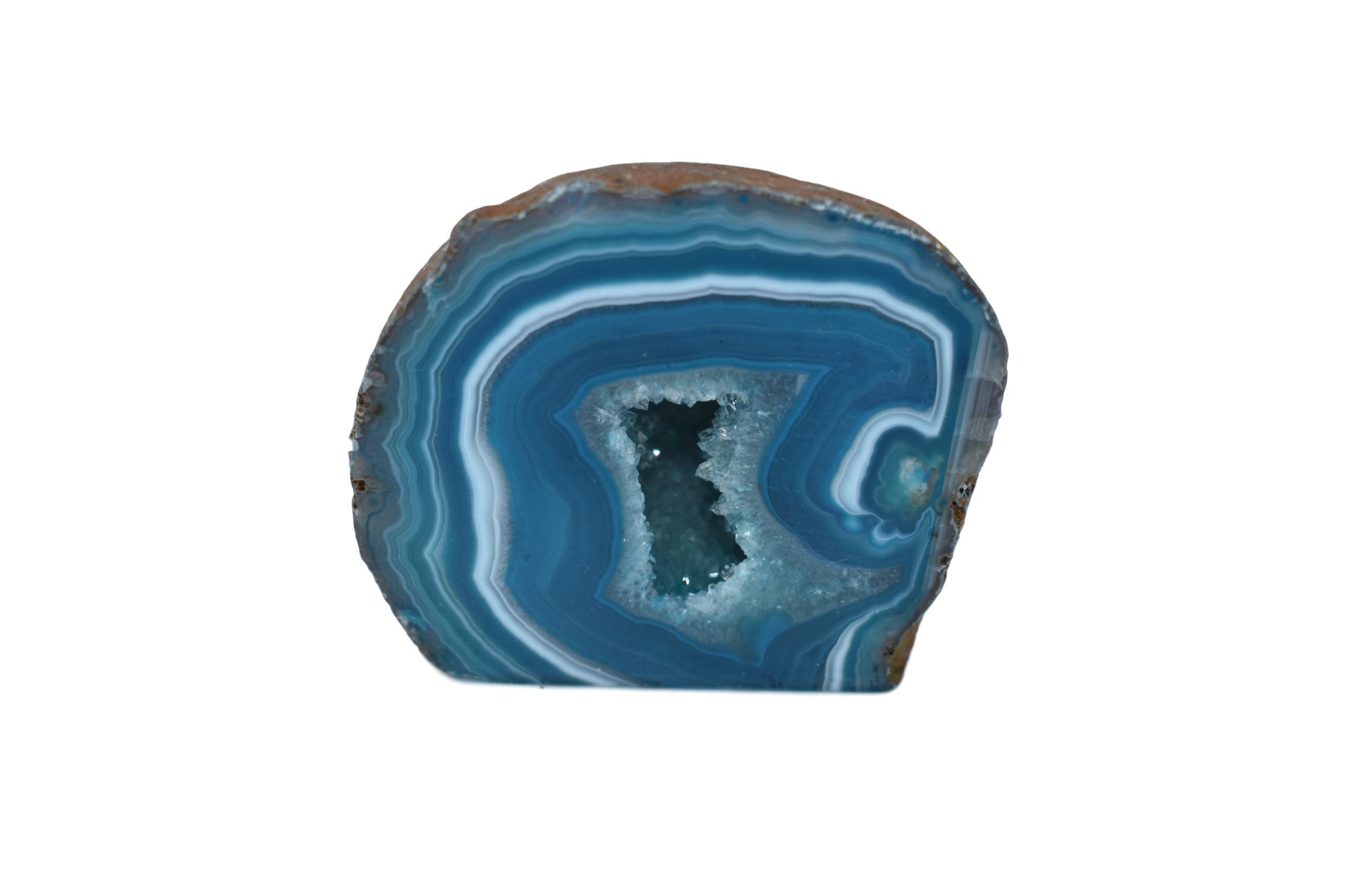 A collection of small, medium, and large agate geodes showcasing vibrant colors and unique crystal formations, perfect for home decoration.