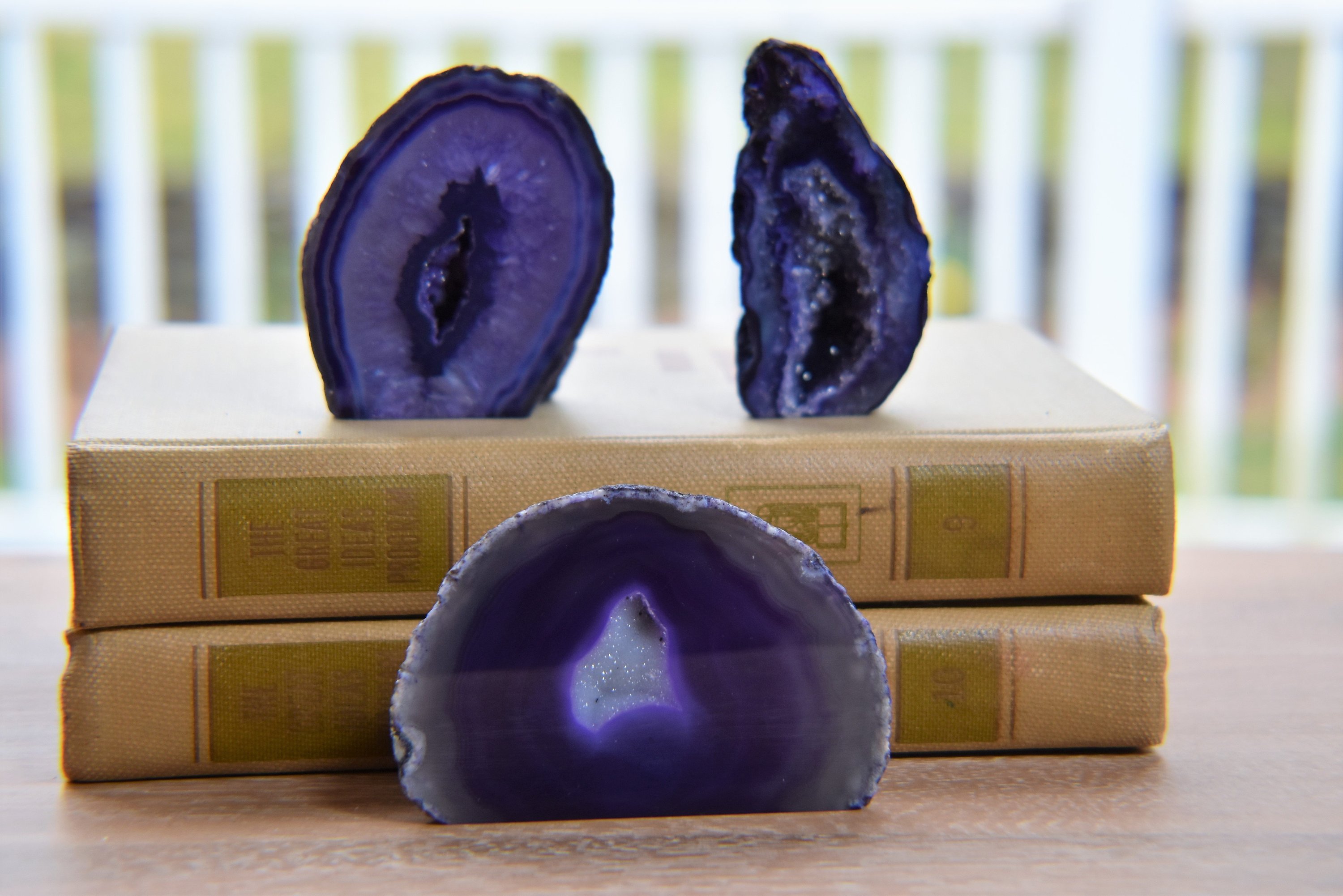 A collection of small, medium, and large agate geodes showcasing vibrant colors and unique crystal formations, perfect for home decoration.