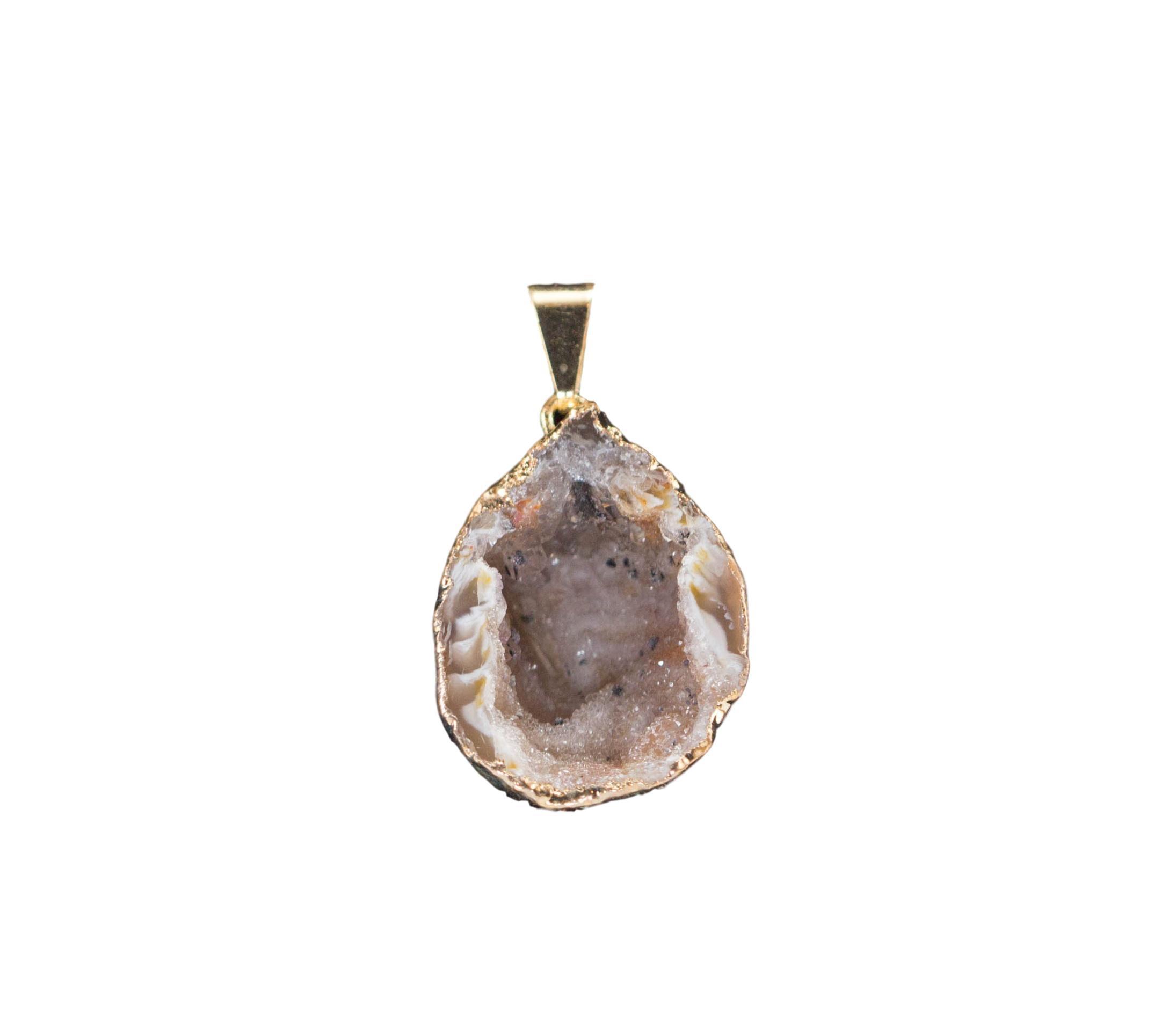 A collection of elegant agate sculpture pendants in various designs, including leaf, heart, and dolphin, trimmed in silver and gold.