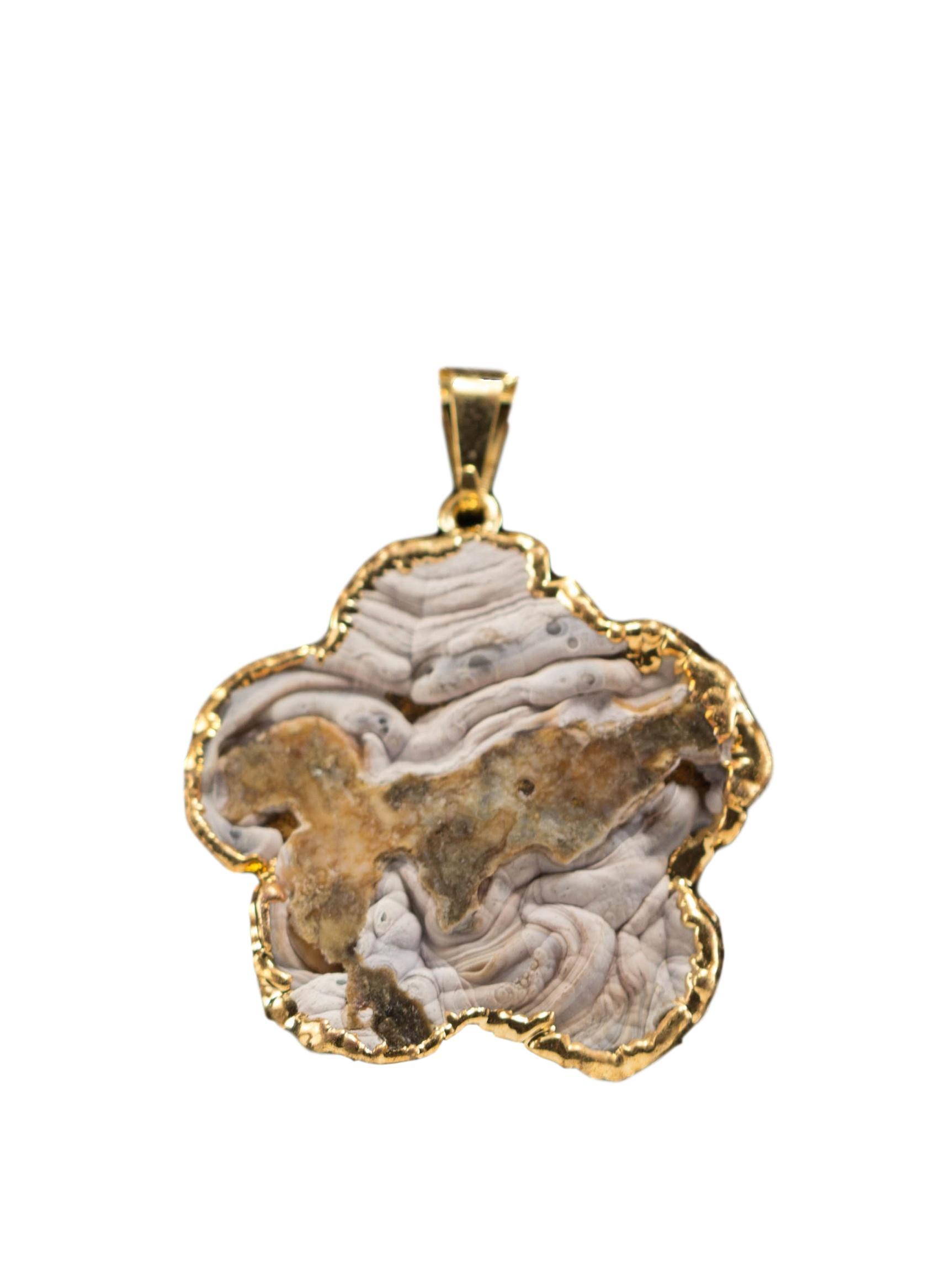 A collection of elegant agate sculpture pendants in various designs, including leaf, heart, and dolphin, trimmed in silver and gold.